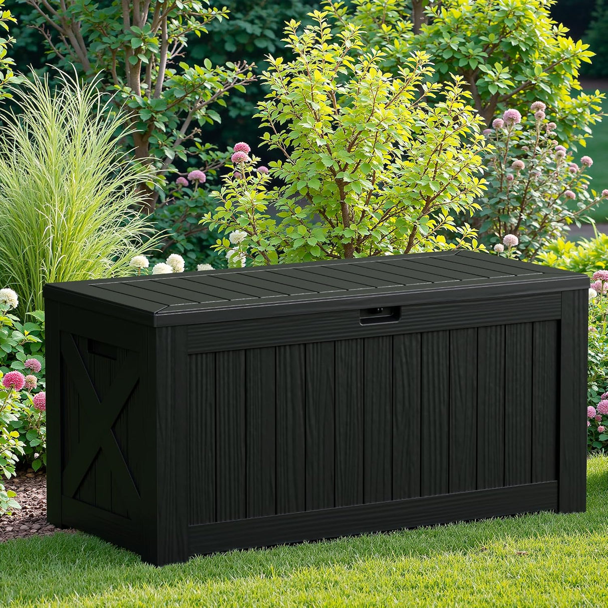 Patioslife black outdoor storage box on garden lawn for patio cushions and garden accessories