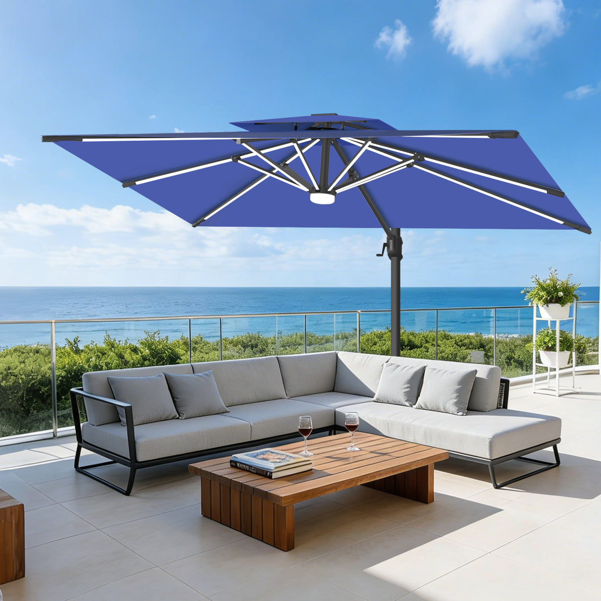 Patioslife navy blue cantilever parasol with LED lights shading outdoor sofa by sea view patio