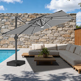 Patioslife grey cantilever parasol with LED lights over outdoor sofa set on stone wall patio