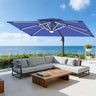 Patioslife navy blue cantilever parasol with LED lights shading outdoor sofa by sea view patio