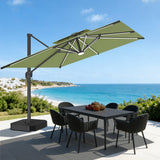 Patioslife sage green cantilever parasol with LED lights over garden dining set by the coast