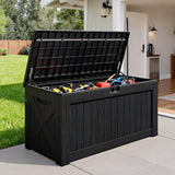 Patioslife black outdoor storage box for tools and patio accessories beside garden entrance